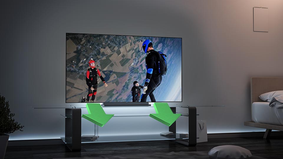 TV with down-firing speakers projecting sound downward